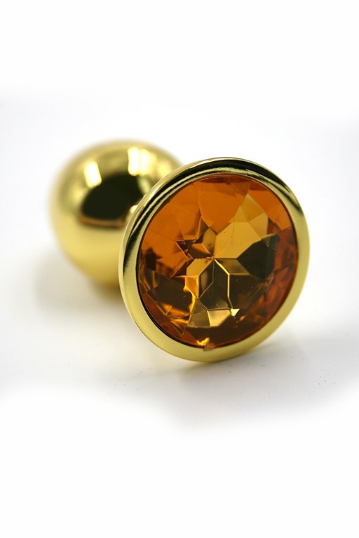 Золотистая анальная пробка с ярко-оранжевым кристаллом, 6х2,8 см - фото 148643